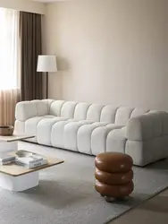 Elegant curved seating with soft neutral upholstery